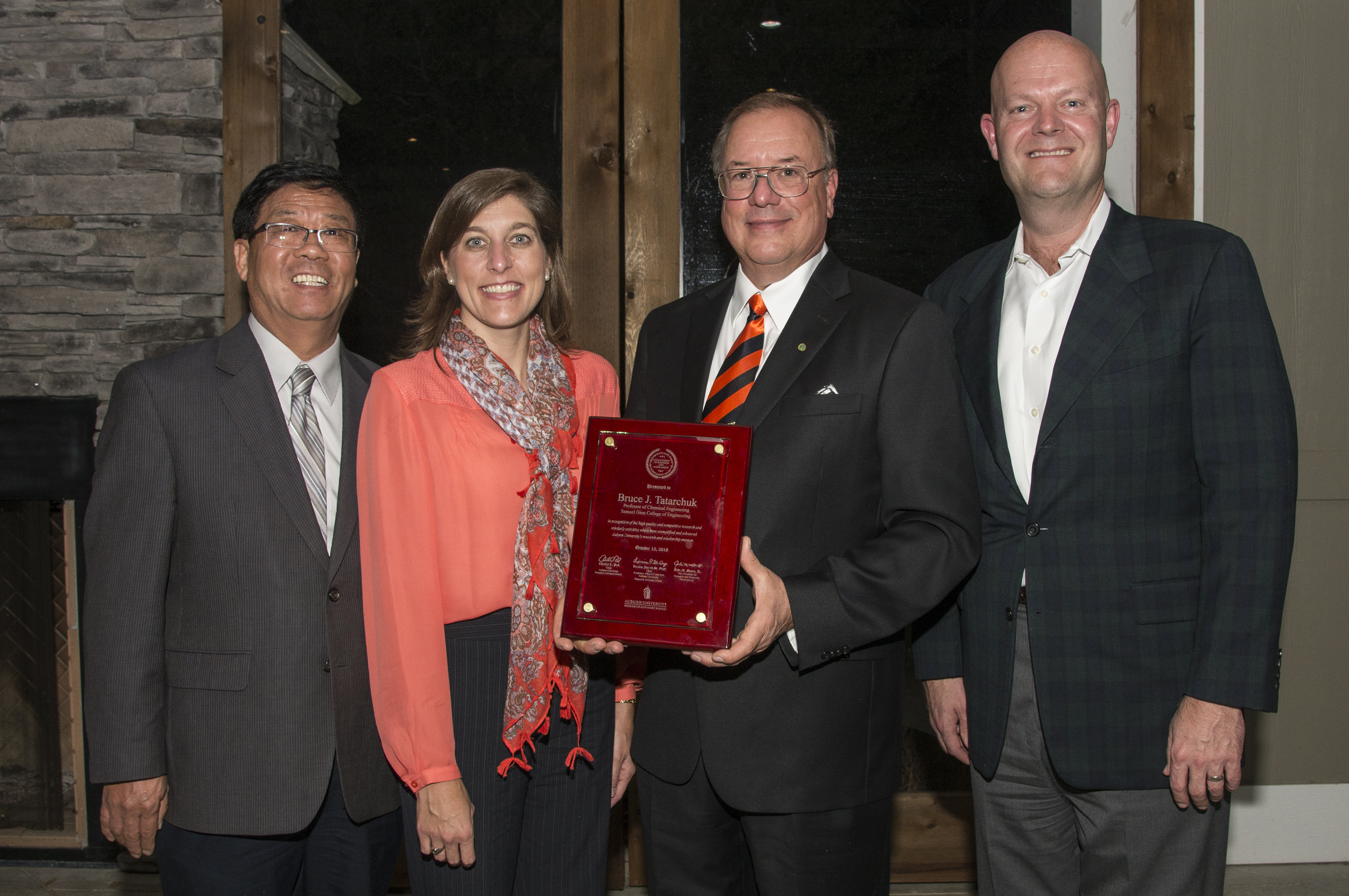 Dr. Bruck Tatarchuk receives the 2016 Research Advisory Board Advancement of Research & Scholarship Achievement Award from Dr. John Liu, Assoc. Provost & Associate VP for Research, Dr. Lori St. Onge, board member, and Mr. Charles Pick, board chair.